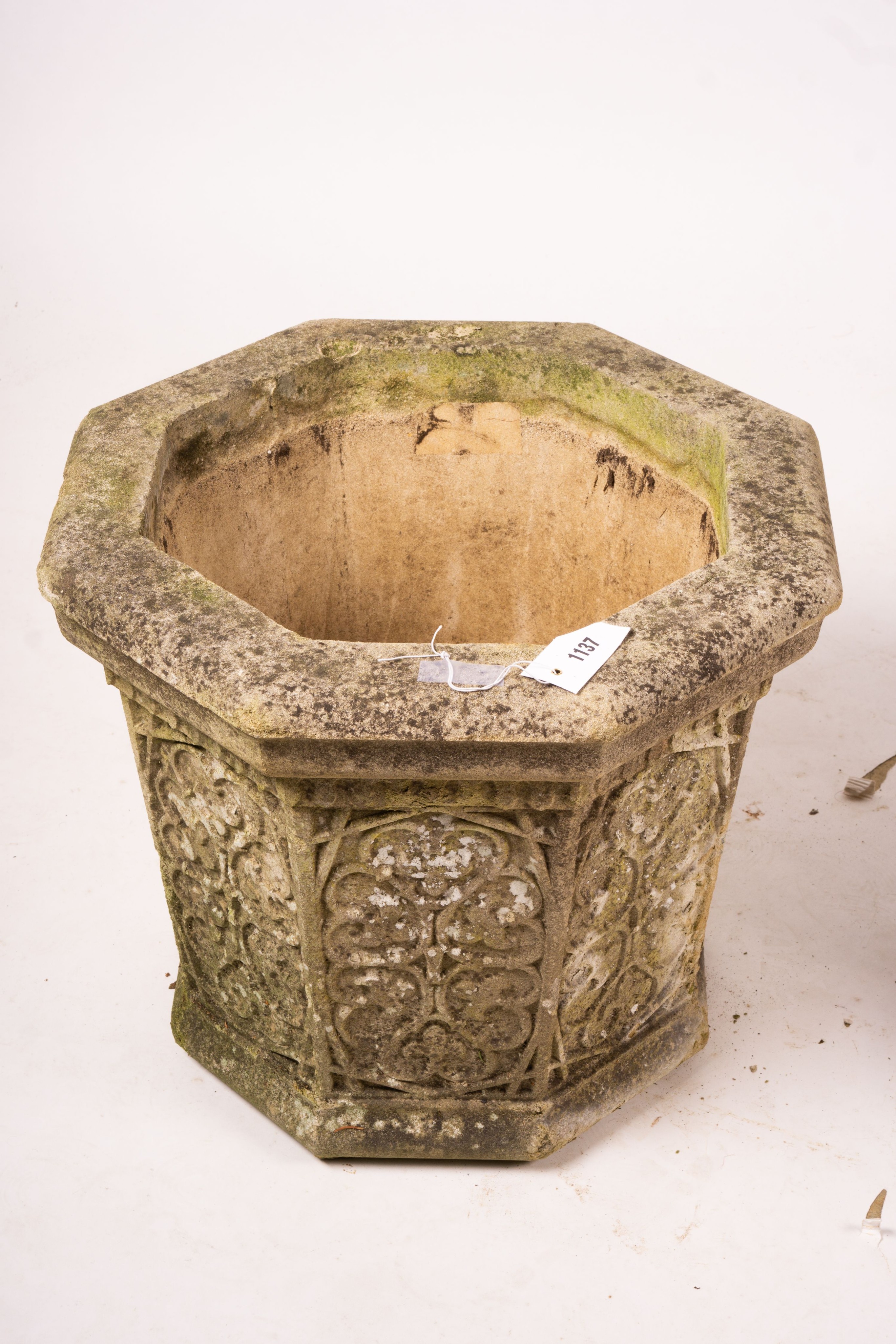 A pair of octagonal reconstituted stone garden planters, width 48cm, height 42cm